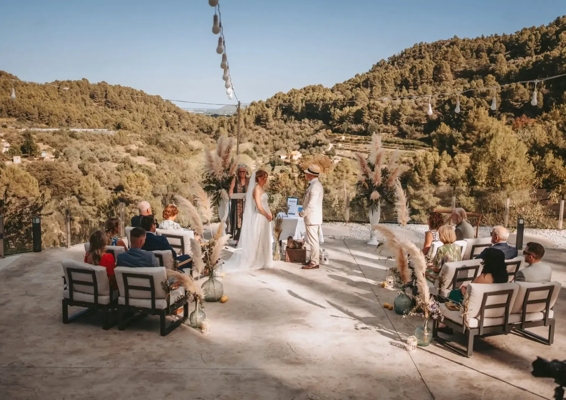 A long table set on the terrace above the valley