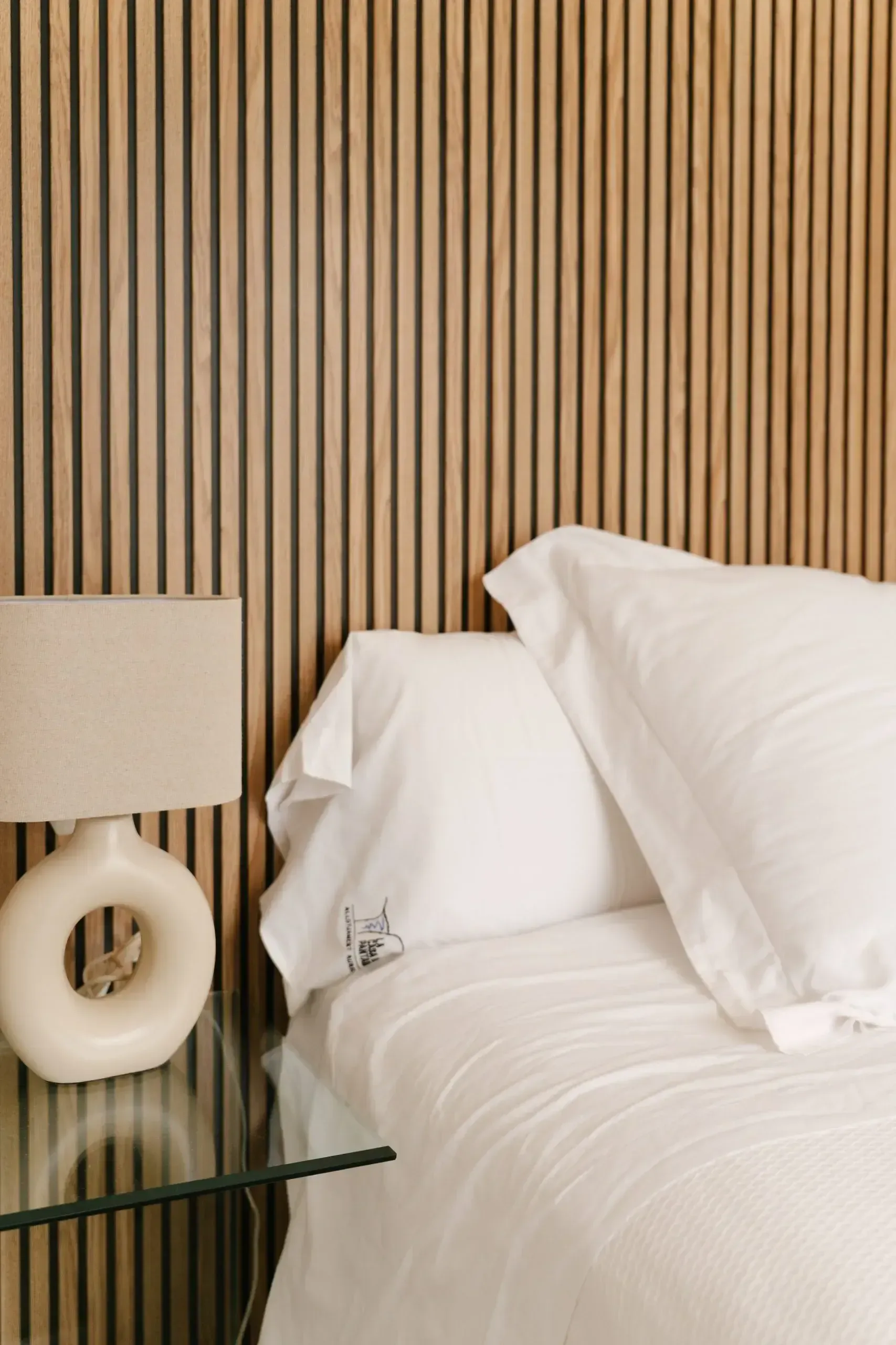 Bedroom with rattan headboard and soft light