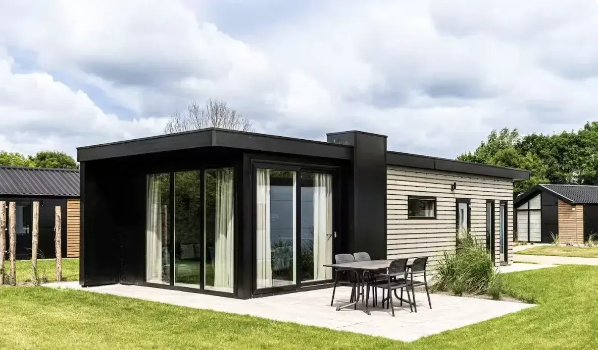 A villa opening onto the lawn at Kaag