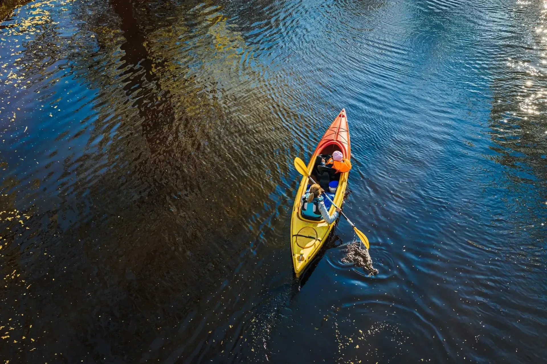 Canoeing across calm water
