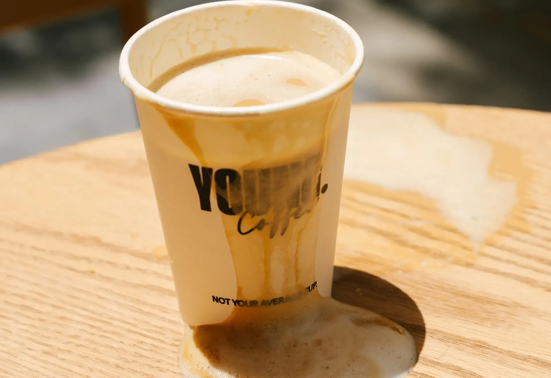 A YOUNG Coffee cup on the table in the morning light