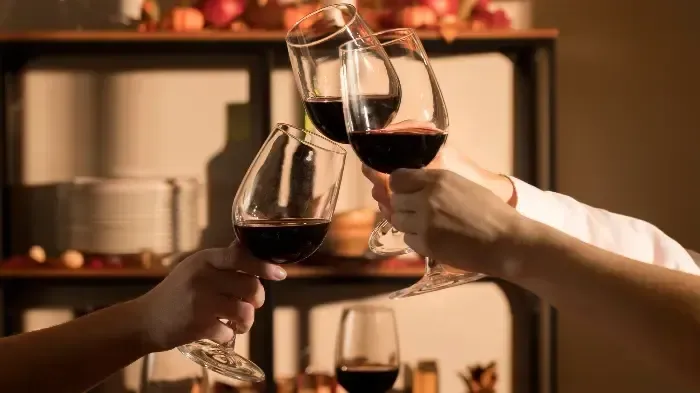 Red wine poured during a winery tour
