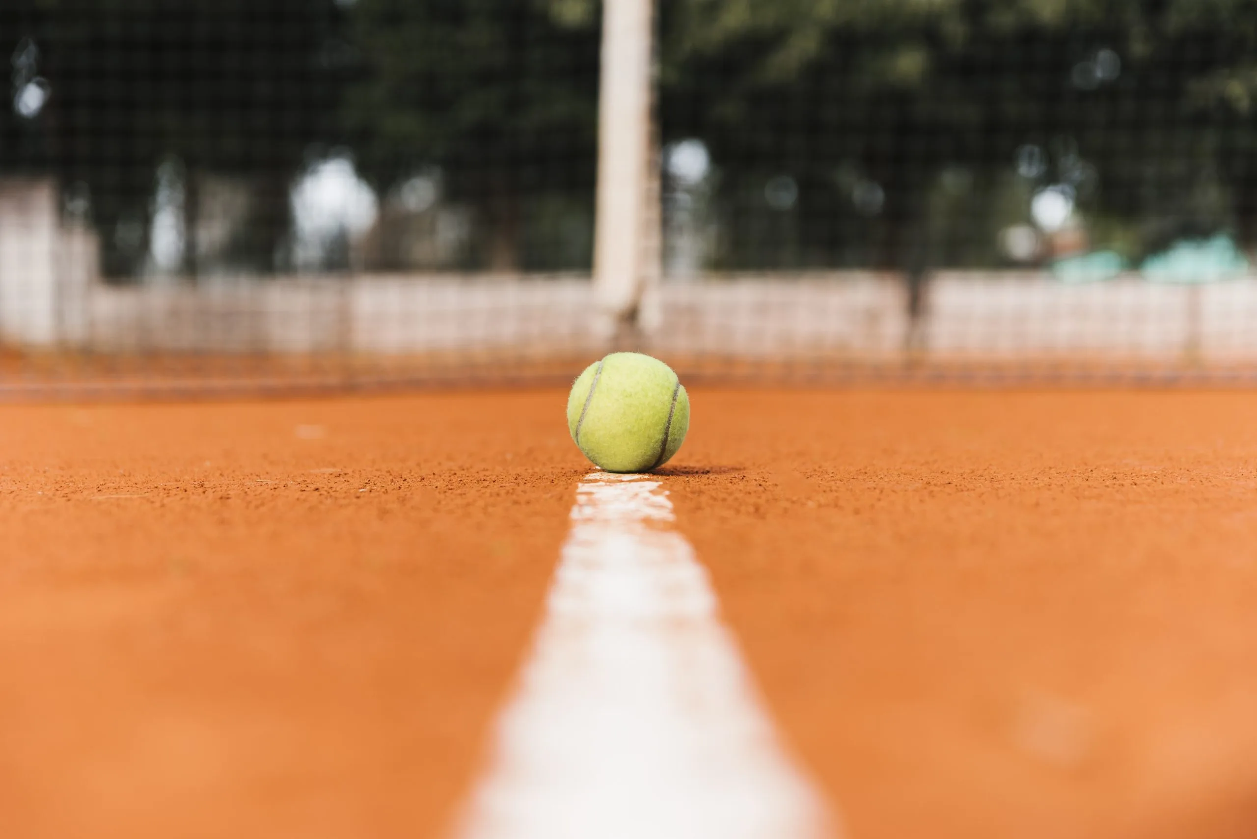 Tennis ball laying floor